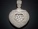 a heart shaped diamond pendant on a black background