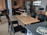 a dining room with a table and chairs in it