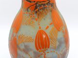 a vase with a design on it on a white surface