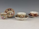 three cups and saucers are sitting next to each other on a table
