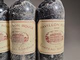 three bottles of wine sitting on top of a table next to each other