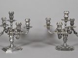 pair of silver plated candelabs with candlesticks on stands