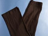 a pair of brown pants sitting on top of a blue surface