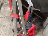 a picture of a clamp and wrench on the ground next to a truck