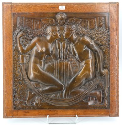 an antique bronze plaque depicting three nudes in a garden