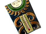 a thermometer with a picture of a sun on it