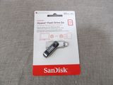 an image of a usb drive with a card attached to it