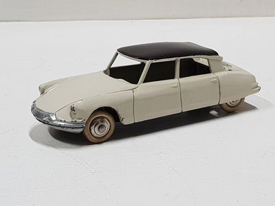 a toy car that is sitting on a white surface
