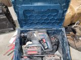 a blue tool box with tools in it on the floor
