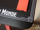 a black table with a red piece of paper on top of it
