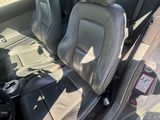 the interior of a car with two seats and a steering wheel