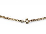 a close up of a gold chain on a white background