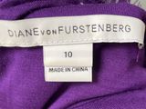 the label on a purple shirt reads dane on furstenberg