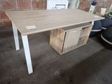 a wooden desk with a drawer underneath it in a room