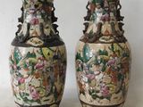 two vases that are sitting on a table