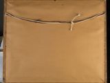 painting on easel with a piece of brown paper tied to it