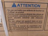 a label on the back of a box that says attention