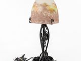 a table lamp with a marble shade on top of it
