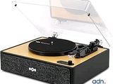 an image of a record player sitting on top of a wooden table