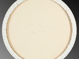an oval white plate with a design on the rim