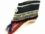 a close up of a pair of shoes with fringes on them