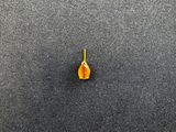 a close up of a single yellow flower on a black surface
