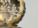 a close up view of a clock on a table
