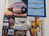 two books on a table with a plane and a plane