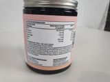 a jar of honey sitting on a table with a label on it