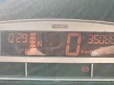 a digital clock on the dashboard of a car