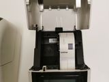 a printer that is sitting on a table next to a printer