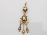 a gold and diamond pendant
