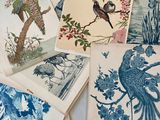 many cards with birds and flowers on them on a table