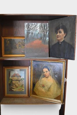 two paintings on a shelf with a picture of a man and a woman