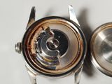 a close up of a watch that is on a table