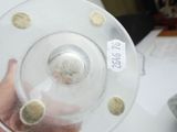 a person holding a plastic object with holes in it