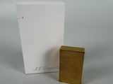 an image of a lighter and a box on a table