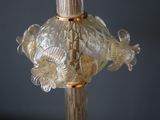 a glass lamp that has a fish on it