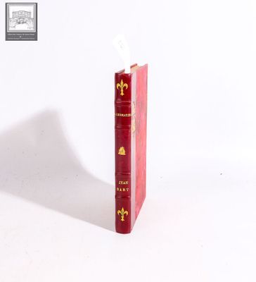 a red book that is sitting on top of a white table