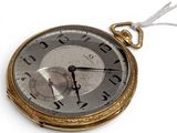 a gold pocket watch with a white string around it