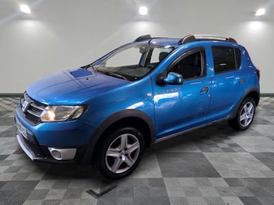 the blue dacia is parked in a room with a checkered floor
