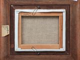 a close up of a picture frame with a piece of paper attached to it
