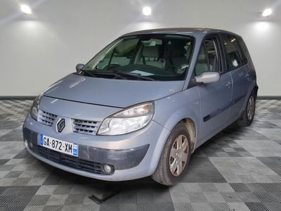 a picture of a small blue car parked in a garage