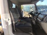a white truck with black seats in the back of it