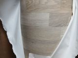 a close up of a piece of paper on a mannequin