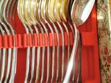 silverware in a red box with red handles and spoons in it