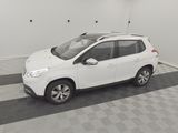 a picture of a white car parked in a garage