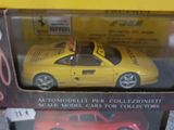 yellow toy car in a box on display for sale in a store
