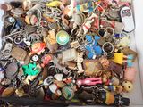 a box full of assorted key chains and other items