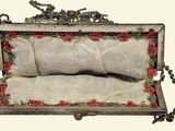 a small box with a pillow inside of it